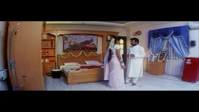 Softcore first-night moment from a Telugu film, frame 3 of 8